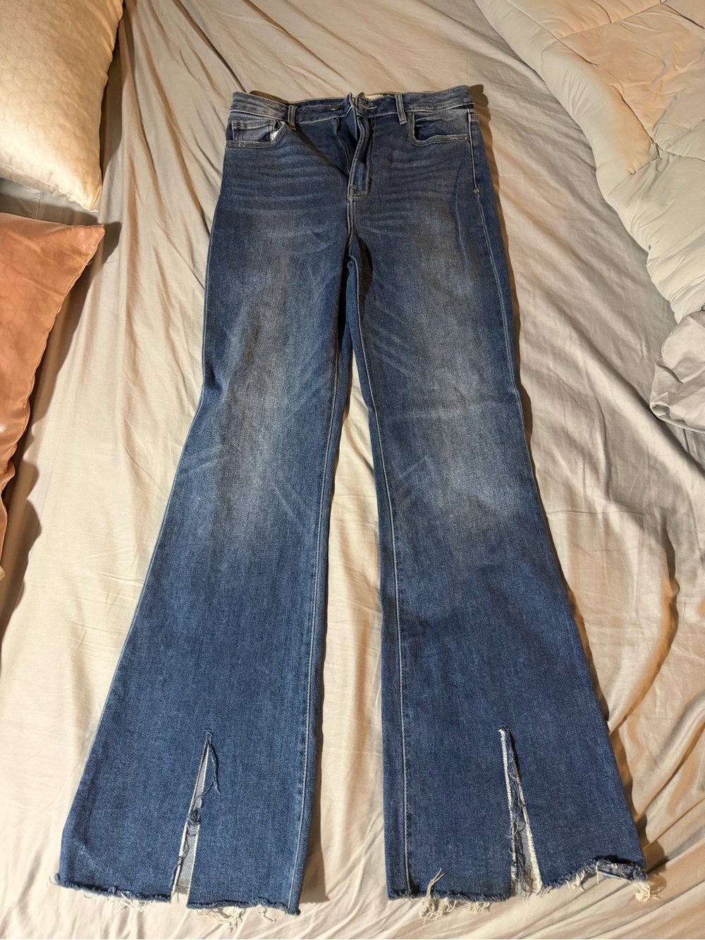 High-Rise Blue Flare Jeans with Raw Hem and Front Slits